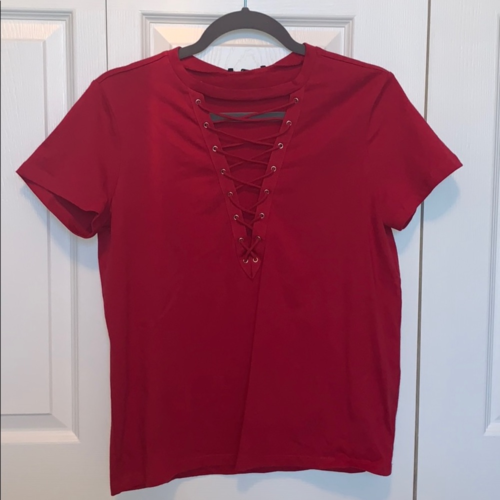 Red shirt with tie up detailing in the front